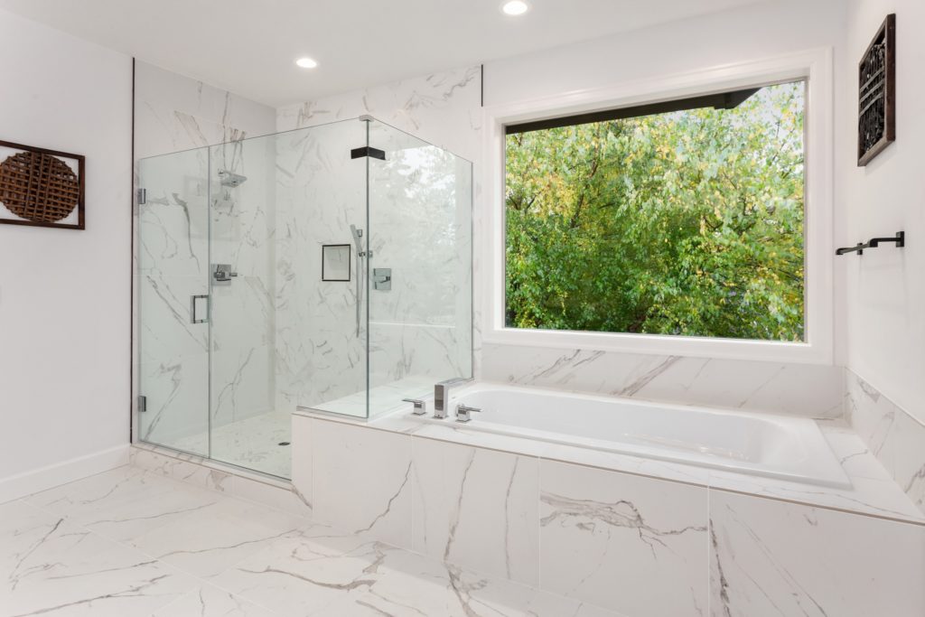 A beautiful bathroom with white natural stone elements.